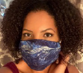 Calynn Evans sewing a face mask at home.