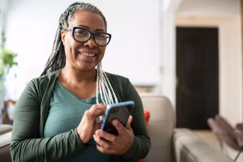 Portrait of a senior woman using a mobile phone at home