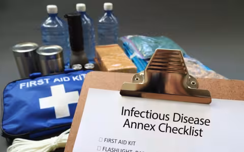 Infections Disease Annex Checklist with a first-aid kit, canned goods, flashlight and bottled water